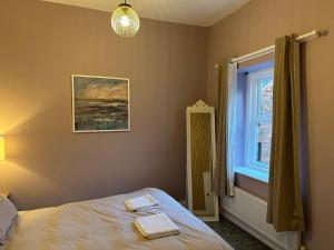 Ένα ή περισσότερα κρεβάτια σε δωμάτιο στο The Maisonette central Buxton