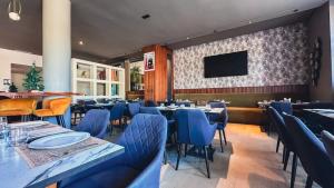 TV a/nebo společenská místnost v ubytování Urban Hotel & Spa