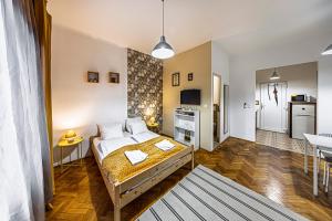 Ένα ή περισσότερα κρεβάτια σε δωμάτιο στο Colors Apartments