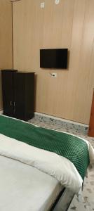 TV/trung tâm giải trí tại Yellow Divine Stay +10 ảnh