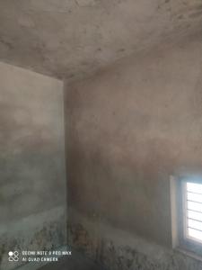 an empty room with a window in the ceiling at House in Mirjān