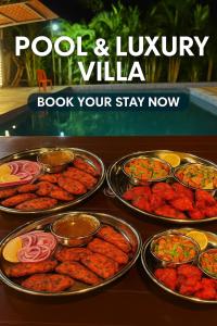 a bunch of trays of food on a table at Evergreen bliss farm in Karjat