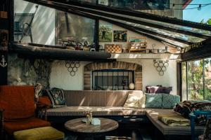 a living room with a couch and a fireplace at Varsádi Birtok Piano in Somlóvásárhely