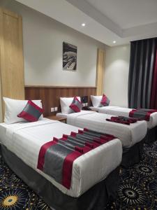 Postel nebo postele na pokoji v ubytování فندق مسار المسك Masar Almisk Hotel + 1 fotografie