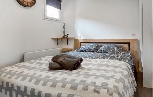 En eller flere senge i et værelse på Appartement Proche Mer