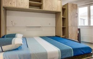 En eller flere senge i et værelse på Appartement Proche Mer + 4 billeder