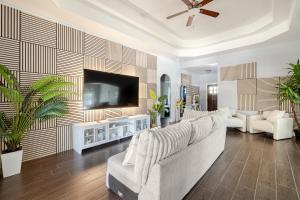 a living room with a couch and a flat screen tv at Welcome to enjoy your home in Dallas