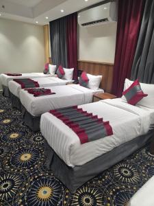 Postel nebo postele na pokoji v ubytování فندق مسار المسك Masar Almisk Hotel