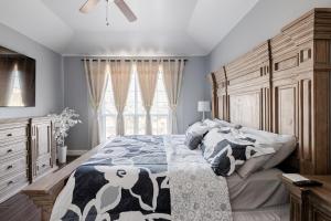 a bedroom with a large bed and a window at Welcome to enjoy your home in Dallas +25 photos