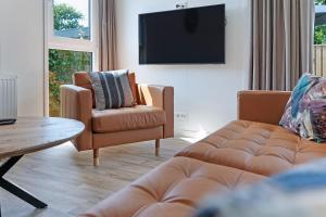 Μια τηλεόραση ή/και κέντρο ψυχαγωγίας στο Chalet Pareloester - Ouddorp