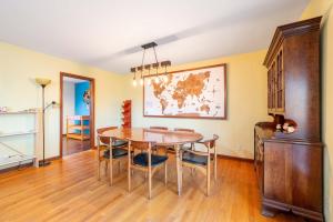 a dining room with a table and chairs at Spacious 4BR Home with BBQ Yard Near Golf Course in Rockford