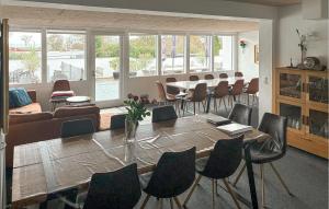 a dining room with a table and chairs at 7 Bedroom Stunning Home In Samsø in Kolby Kås