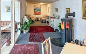 a living room with a heater in a room at 1 Bedroom Beautiful Home In Samsø in Kolby Kås