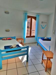 En eller flere senge i et værelse på Gîte Au Fil de l'Eau + 3 billeder