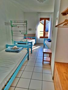 En eller flere senge i et værelse på Gîte Au Fil de l'Eau