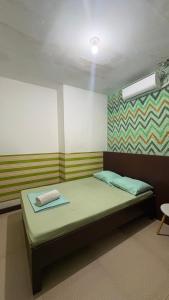 a room with a bed in a room with at ZIUR INN in Laoag