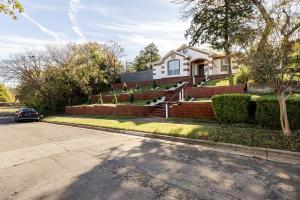 a house on a street with a car parked in front at Welcome to enjoy your home in Dallas