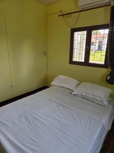 Ένα ή περισσότερα κρεβάτια σε δωμάτιο στο Chidenguele Beach House