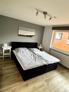 Кровать или кровати в номере Ferienwohnung Krabbe am Wattenmeer