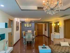 a living room with a couch and a table at Walk-Inn Centaurus Hotel Apartments Islamabad in Islamabad