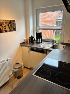 Кухня или мини-кухня в Ferienwohnung Krabbe am Wattenmeer
