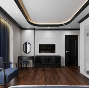 a living room with a flat screen tv on a wall at Royal Hotel Lâm Hạ in Hanoi