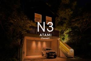 a truck parked in front of a garage at night at N3 ATAMI-Forest- in Atami