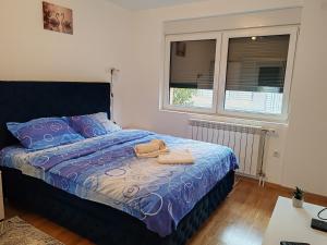 Postel nebo postele na pokoji v ubytování Apartmani Lucky Place + 20 fotografií