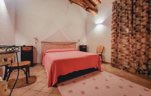 a bedroom with a bed and a table and chairs at Villa Magnolia in Grosseto