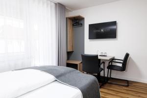 TV a/nebo společenská místnost v ubytování Kurpark Suites