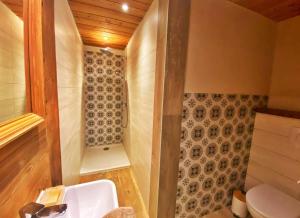 a bathroom with a sink and a toilet at CASA-Salon Bella Ciao Suite pour 5 personnes in Molines-en-Queyras