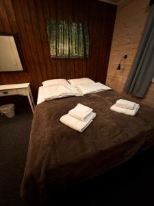 En eller flere senge i et værelse på Ustedalen Lodge, Appartement 1