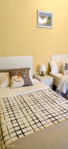 Ένα ή περισσότερα κρεβάτια σε δωμάτιο στο Piso amplio y luminoso, La Pomar