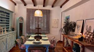 a dining room with a table and some chairs at La Hondonada in Somo