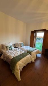 Ένα ή περισσότερα κρεβάτια σε δωμάτιο στο Pouso Du'Vagar +22 φωτογραφίες