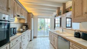 Køkken eller tekøkken på Superbe villa avec piscine chauffée