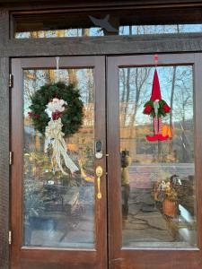 a front door with christmas decorations on it at Laurel Valley Mountain Retreat in Townsend