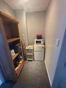 Η κουζίνα ή μικρή κουζίνα στο Cozy-in Rotorua