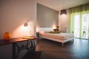 Ένα ή περισσότερα κρεβάτια σε δωμάτιο στο Be Your Home - Guest House Colors