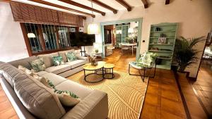 a living room with a couch and a table at La Hondonada in Somo