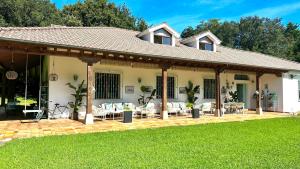 a house with a pavilion on a lawn at La Hondonada in Somo