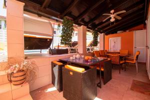 a patio with a table and chairs and a ceiling at Vila Andja in Banjole,Istrien by Istrabook in Banjole