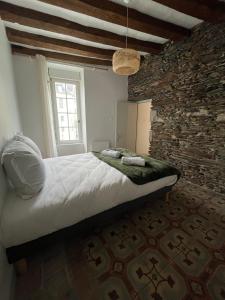 En eller flere senge i et værelse på T3 centre ville 1er étage