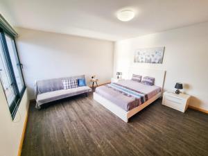 Postel nebo postele na pokoji v ubytování House of Massapez | Calheta