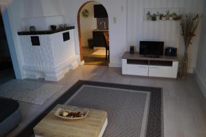 Μια τηλεόραση ή/και κέντρο ψυχαγωγίας στο Ambiente Ferienapartments Julienhöhe