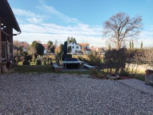 a garden with a bench in the middle of a yard at Malpensa monolocale indipendente in Samarate +7 photos