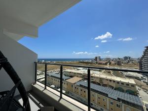 a balcony with a view of a city at Seaview stylish one bedroom apartment in Caesar Romulus 88 in Bahçeler