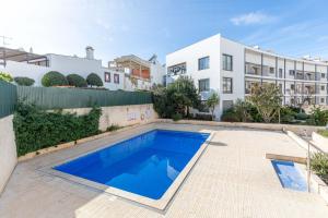 a swimming pool in the backyard of a house at Apartment Atlantico, Town Centre in Tavira
