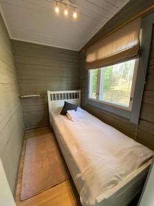 Postel nebo postele na pokoji v ubytování Oravanpesä