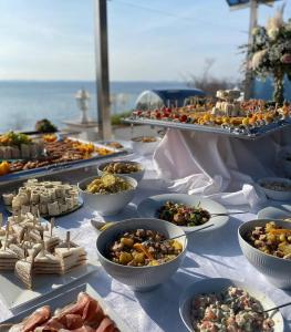 a table with many plates of food on it at Villa Nico in Zadar
